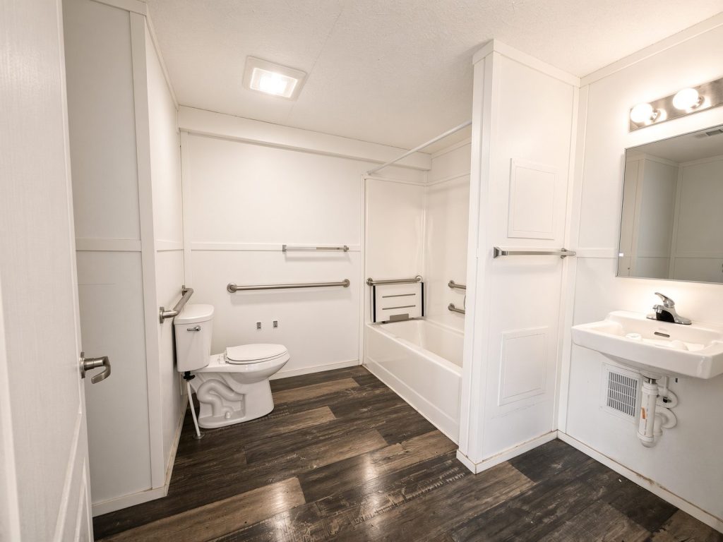 Ocala Landing accessible bathroom with grab bars and tub with bench