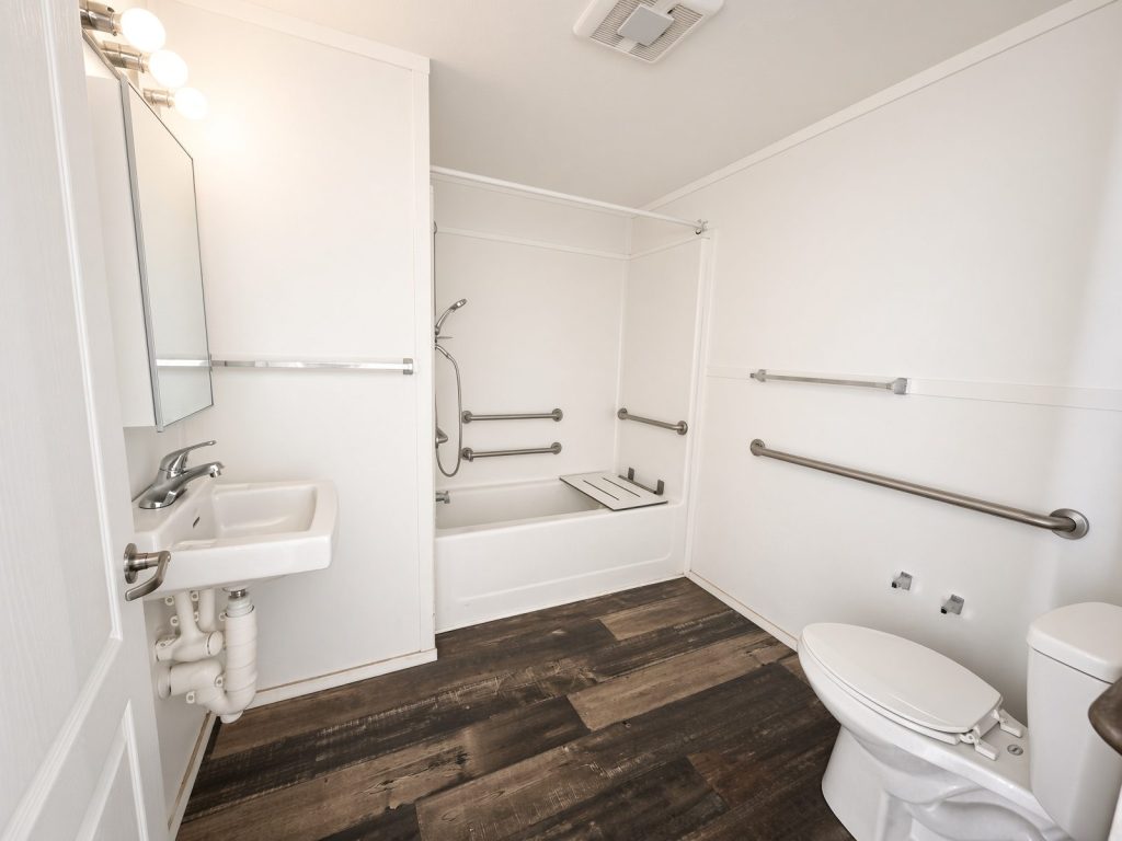 Ocala Landing accessible bathroom with grab bars by the tub and toilet