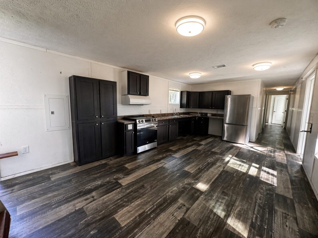 Ocala Landing accessible kitchen with roll-under sink and open living area